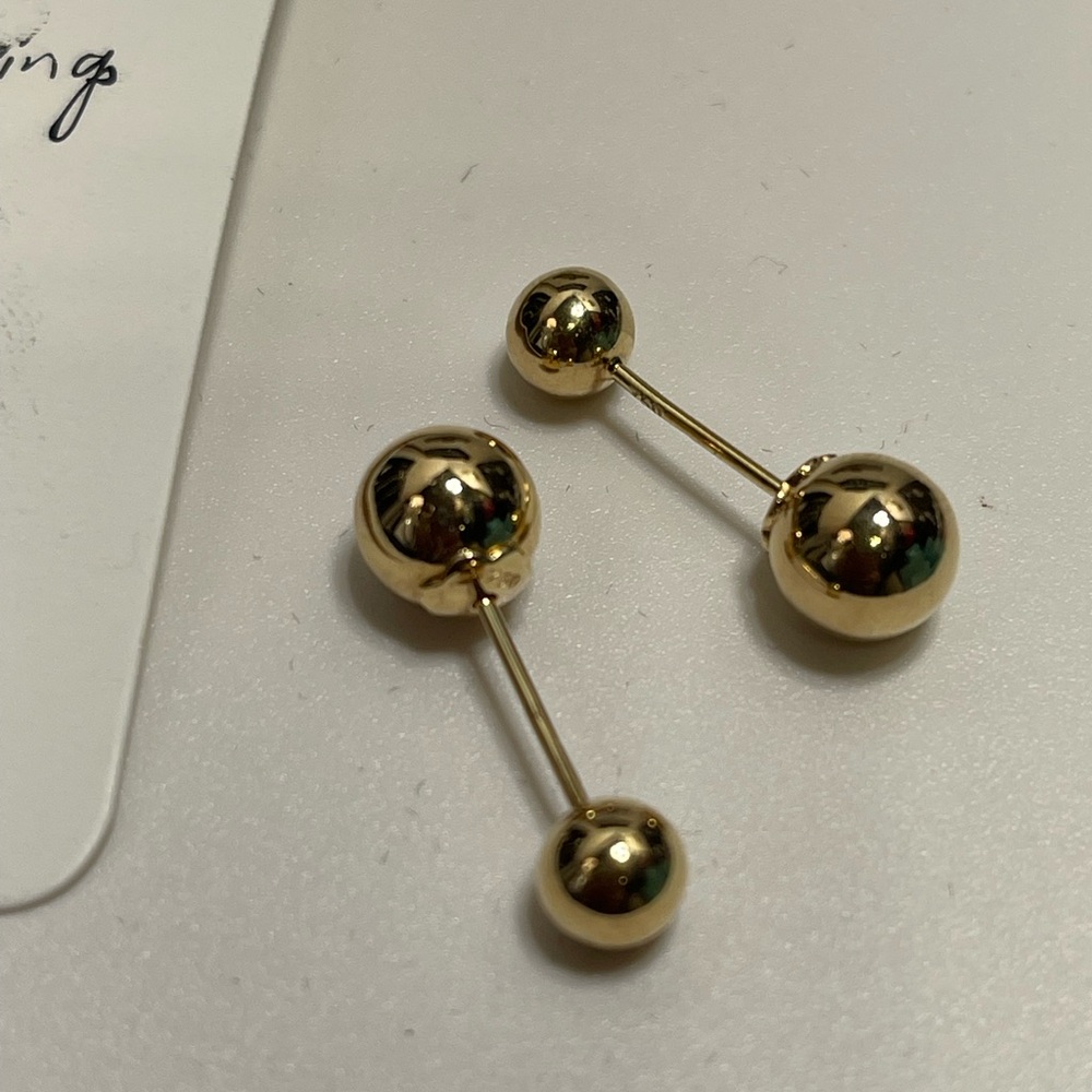 18 k Gold Ball Earrings( Tribal design) .
